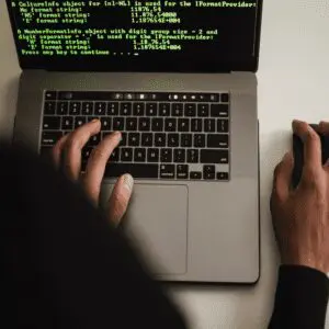 A person creating codes on the laptop